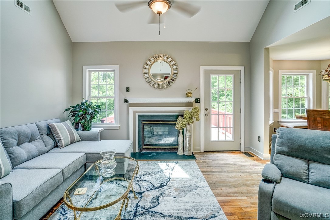 4050 Lake Killarney Road Gum Spring, VA 23065 - Photo 7 of 50 a living room with furniture and a fireplace