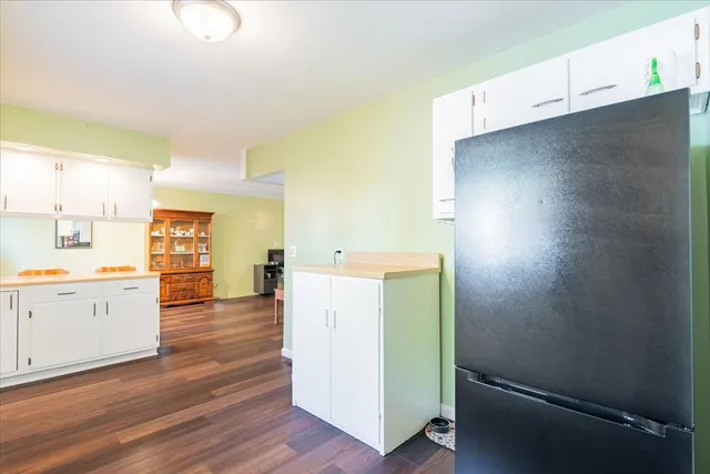 a view of a kitchen with wooden floor
