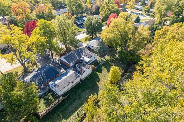 a view of a backyard with sitting area