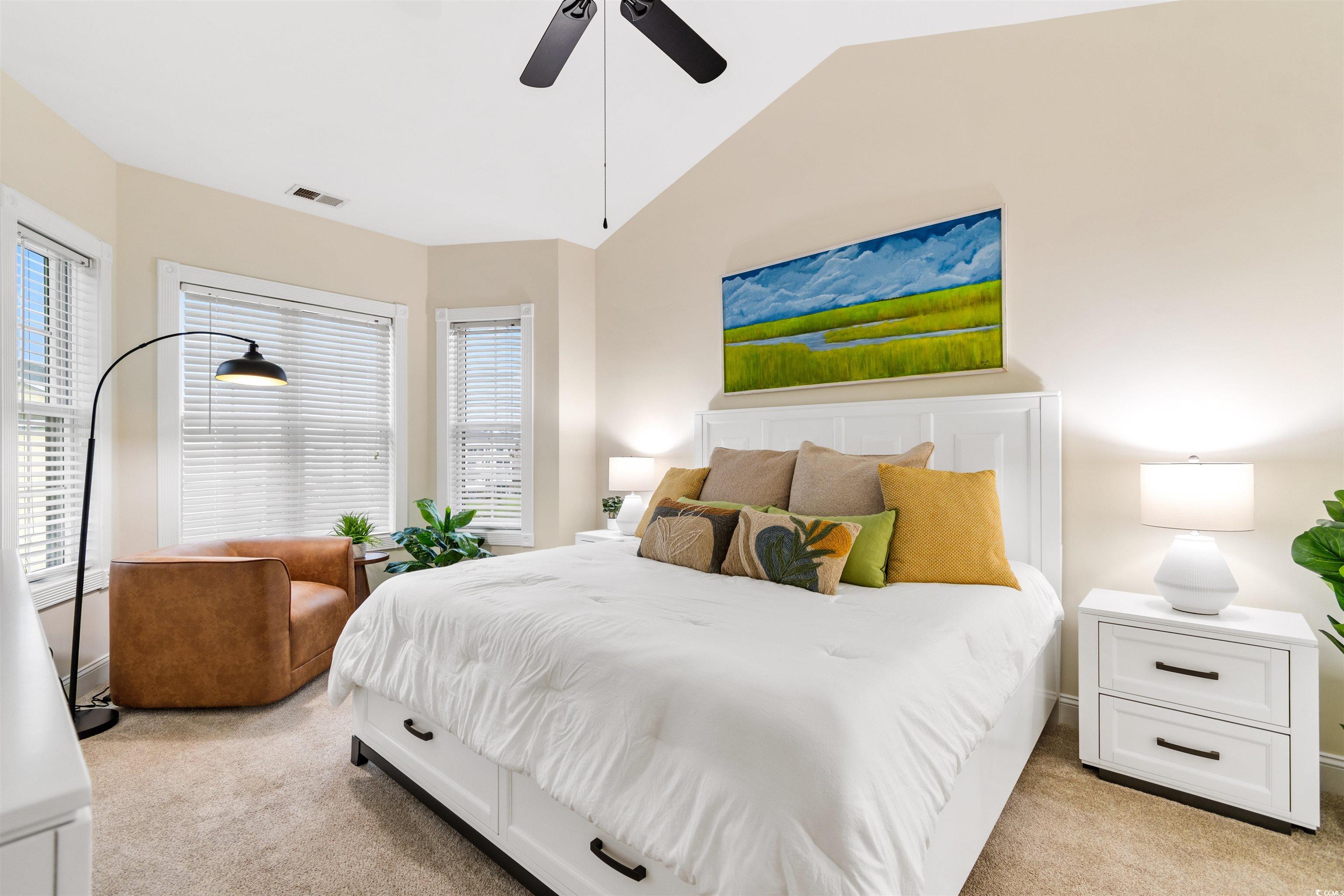 4843 Luster Leaf Circle, Unit 402 Myrtle Beach, SC 29577 - Photo 14 of 33 Bedroom with light carpet, lofted ceiling, and ceiling fan
