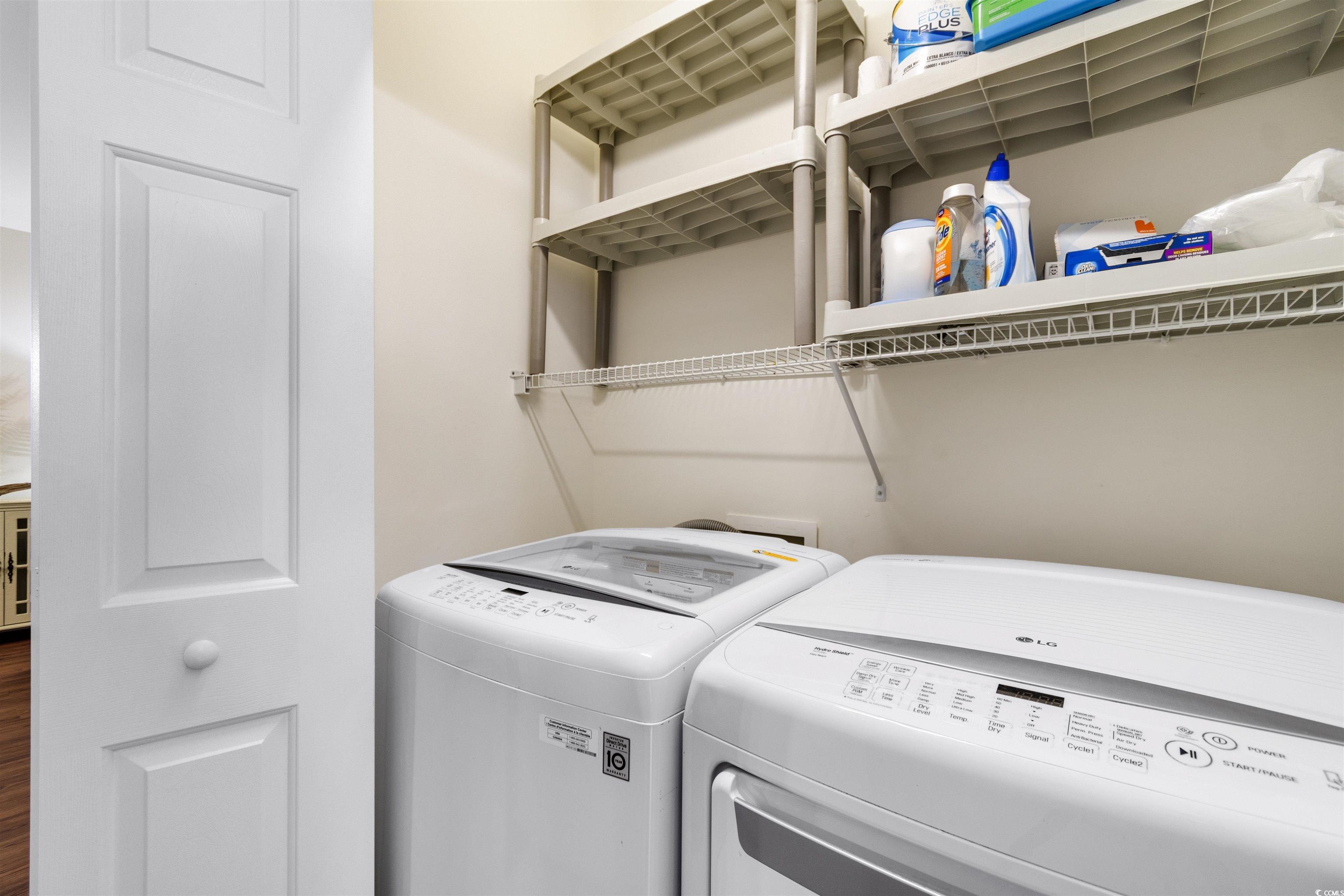 4843 Luster Leaf Circle, Unit 402 Myrtle Beach, SC 29577 - Photo 21 of 33 Washroom with washer and clothes dryer