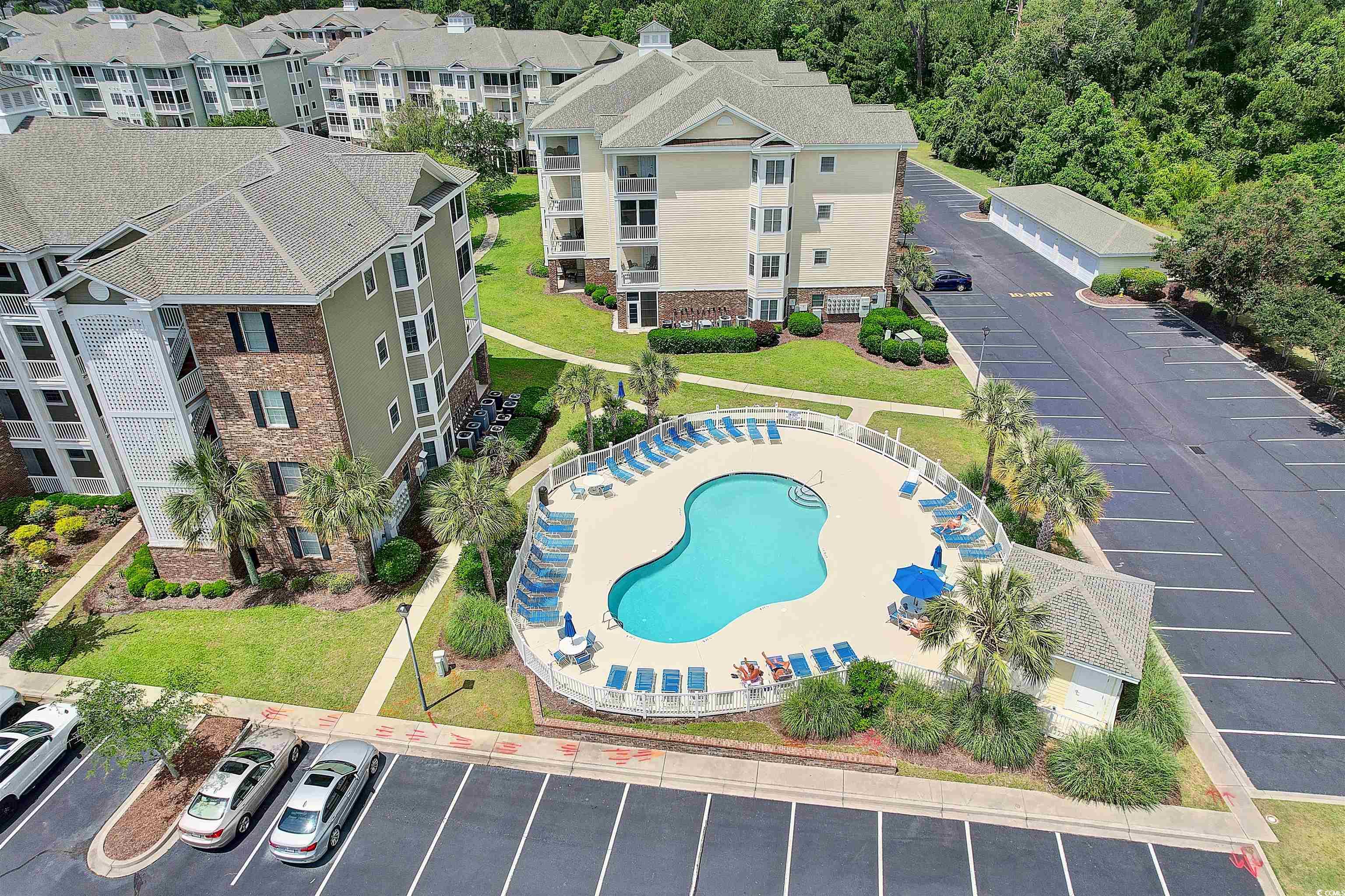 4843 Luster Leaf Circle, Unit 402 Myrtle Beach, SC 29577 - Photo 27 of 33 Drone / aerial view of a pool area