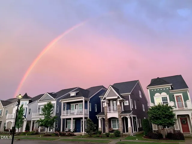 a backyard of a house with yard and outdoor seating