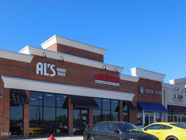 a view of a kitchen with stainless steel appliances