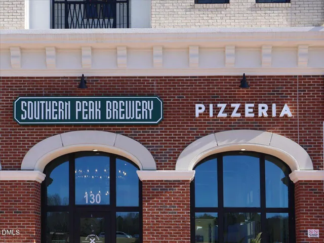 an aerial view of a house with a swimming pool