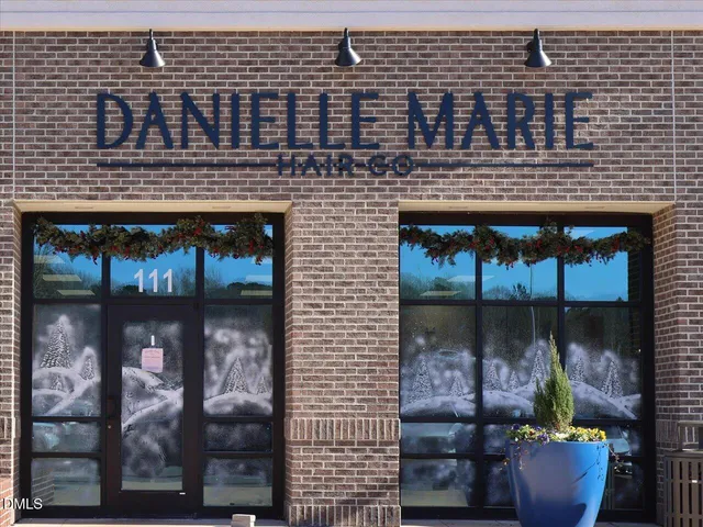 a front view of a house with outdoor seating