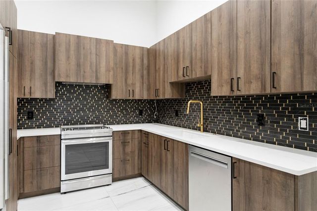 a view of an empty room with windows