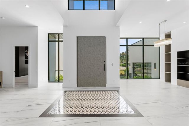 a view of entrance with furniture and window