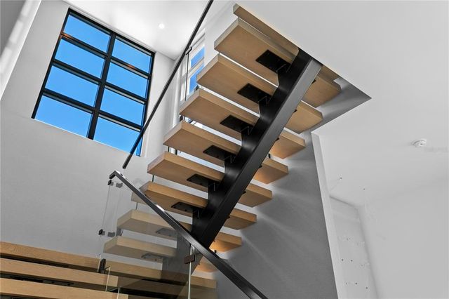 a bathroom with a double vanity sink a mirror and a bathtub