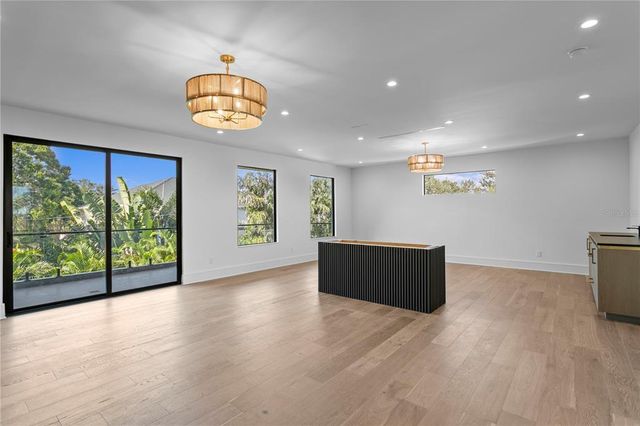 a view of hallway with wooden floor