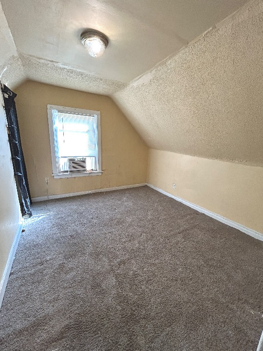 11833 South Perry Avenue Chicago, IL 60628 - Photo 6 of 8 an empty room with a window