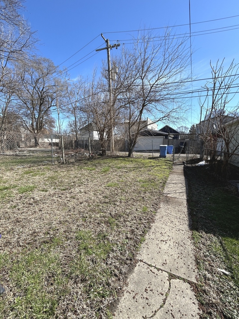 11833 South Perry Avenue Chicago, IL 60628 - Photo 8 of 8 a view of a yard with trees