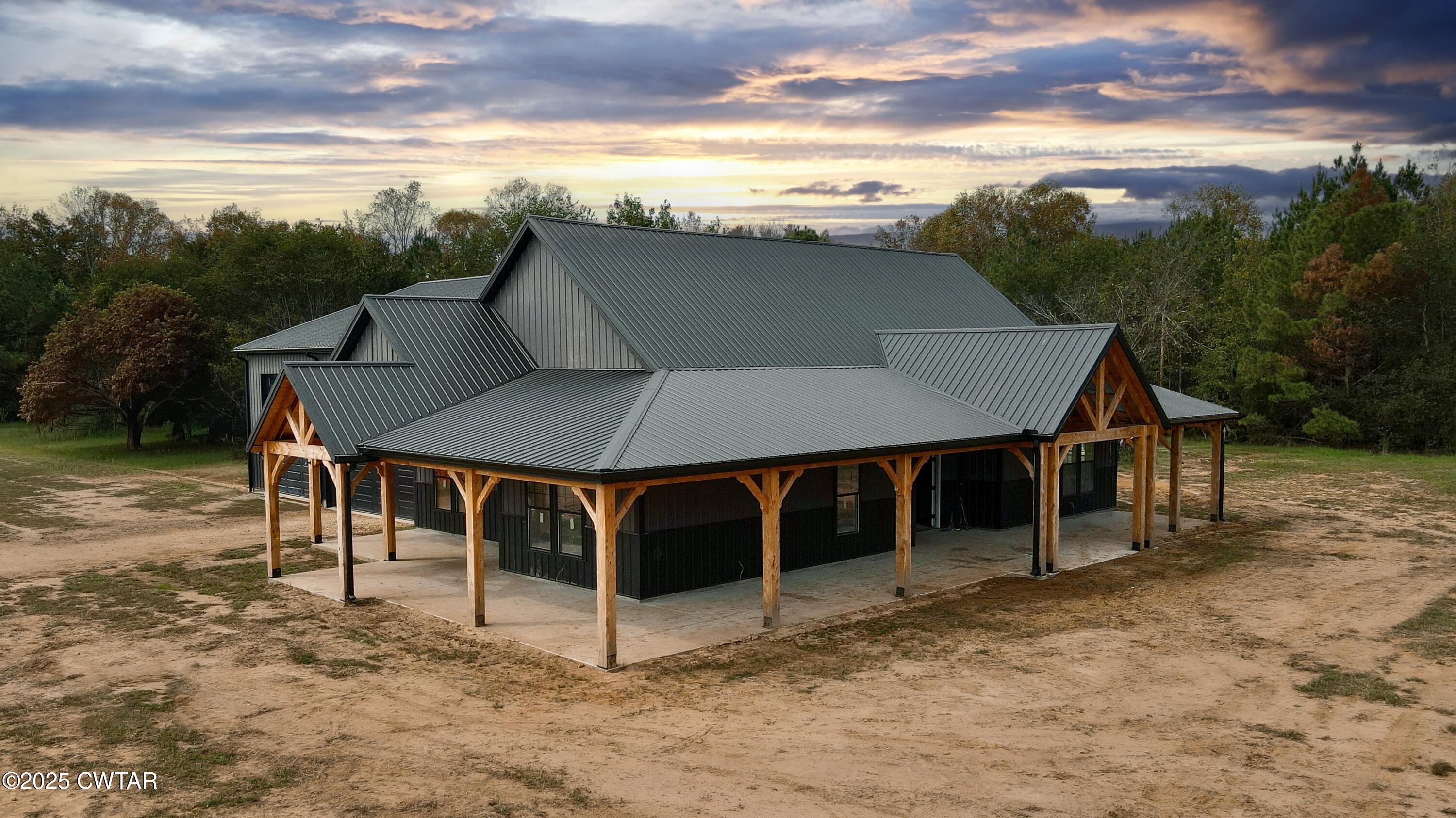 a view of a terrace with a table and chairs