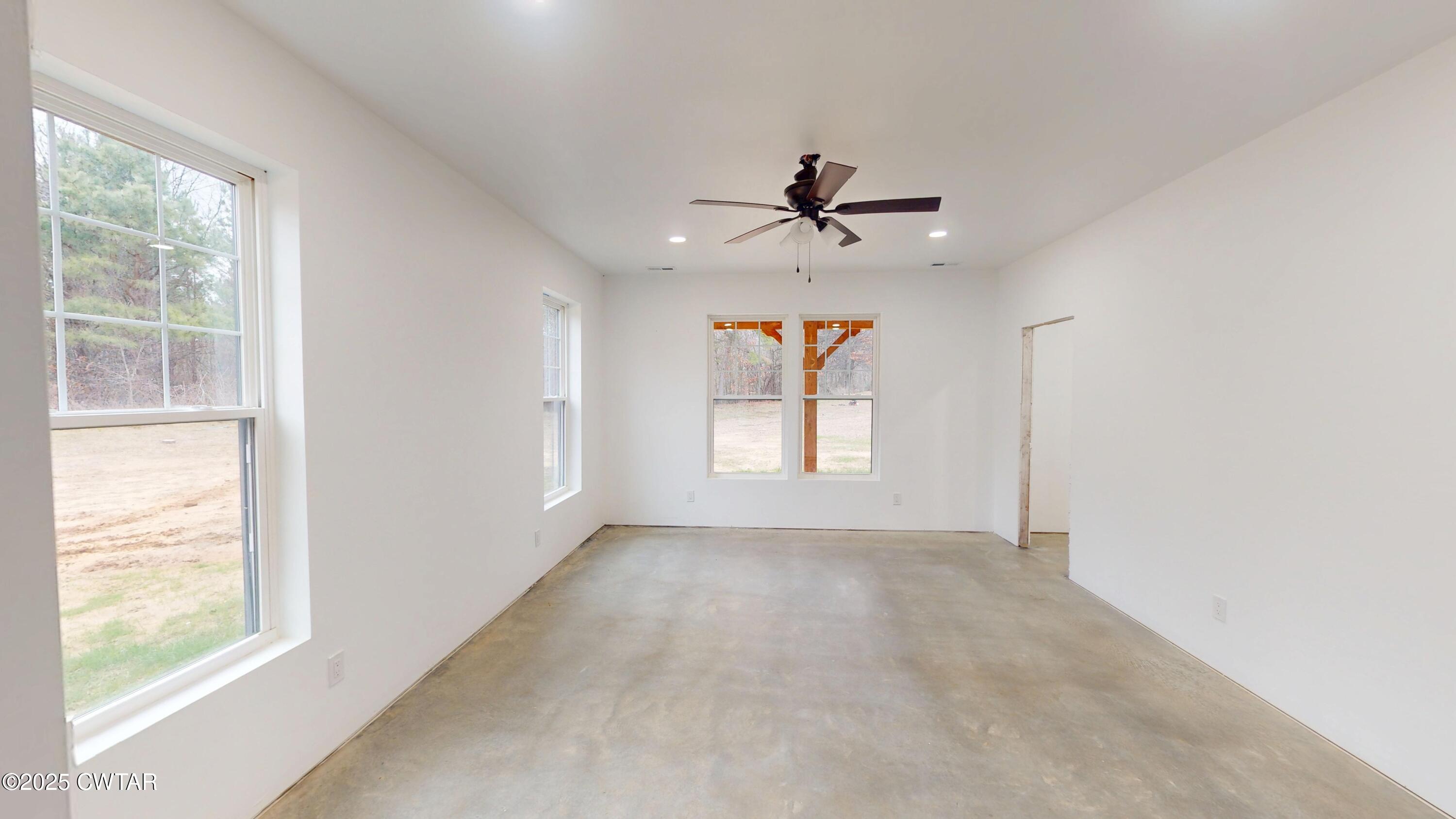 3140 Rowland Mill Road Buena Vista, TN 38318 - Photo 16 of 34 a view of room with a ceiling fan and window