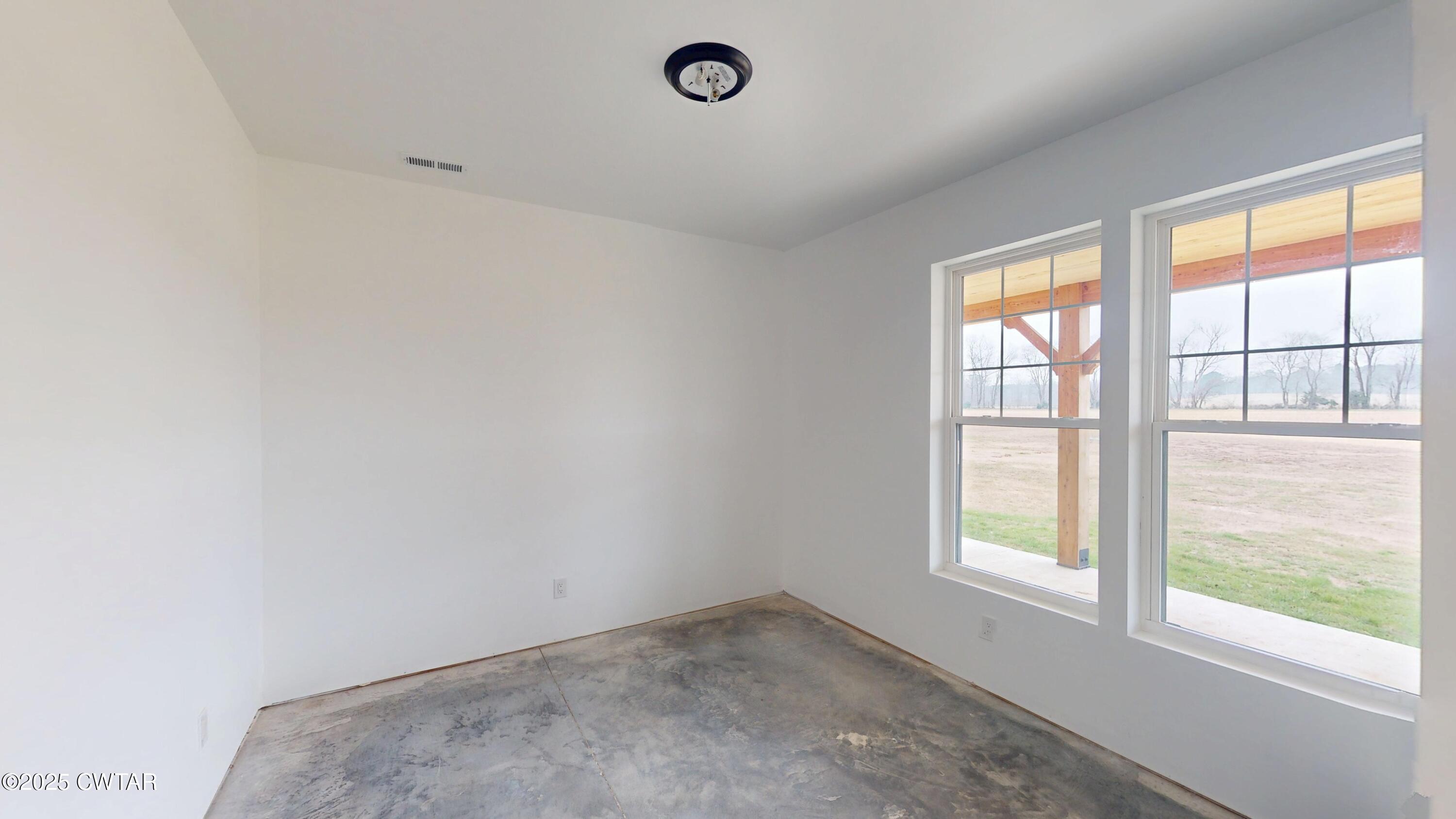 3140 Rowland Mill Road Buena Vista, TN 38318 - Photo 20 of 34 an empty room with windows