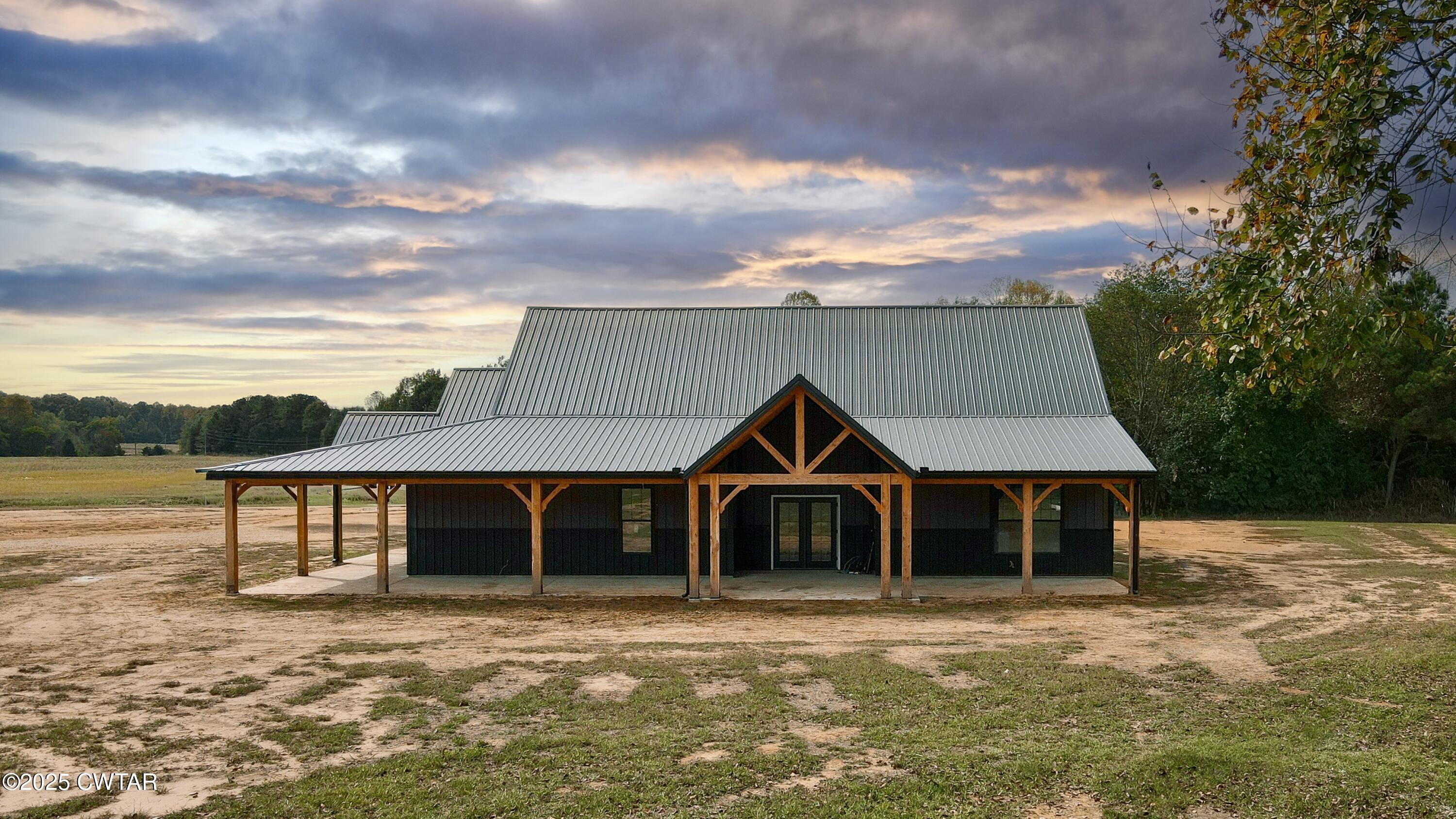 3140 Rowland Mill Road Buena Vista, TN 38318 - Photo 33 of 34 a front view of a house with a yard