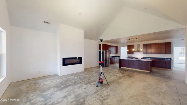 a view of room with a ceiling fan and window
