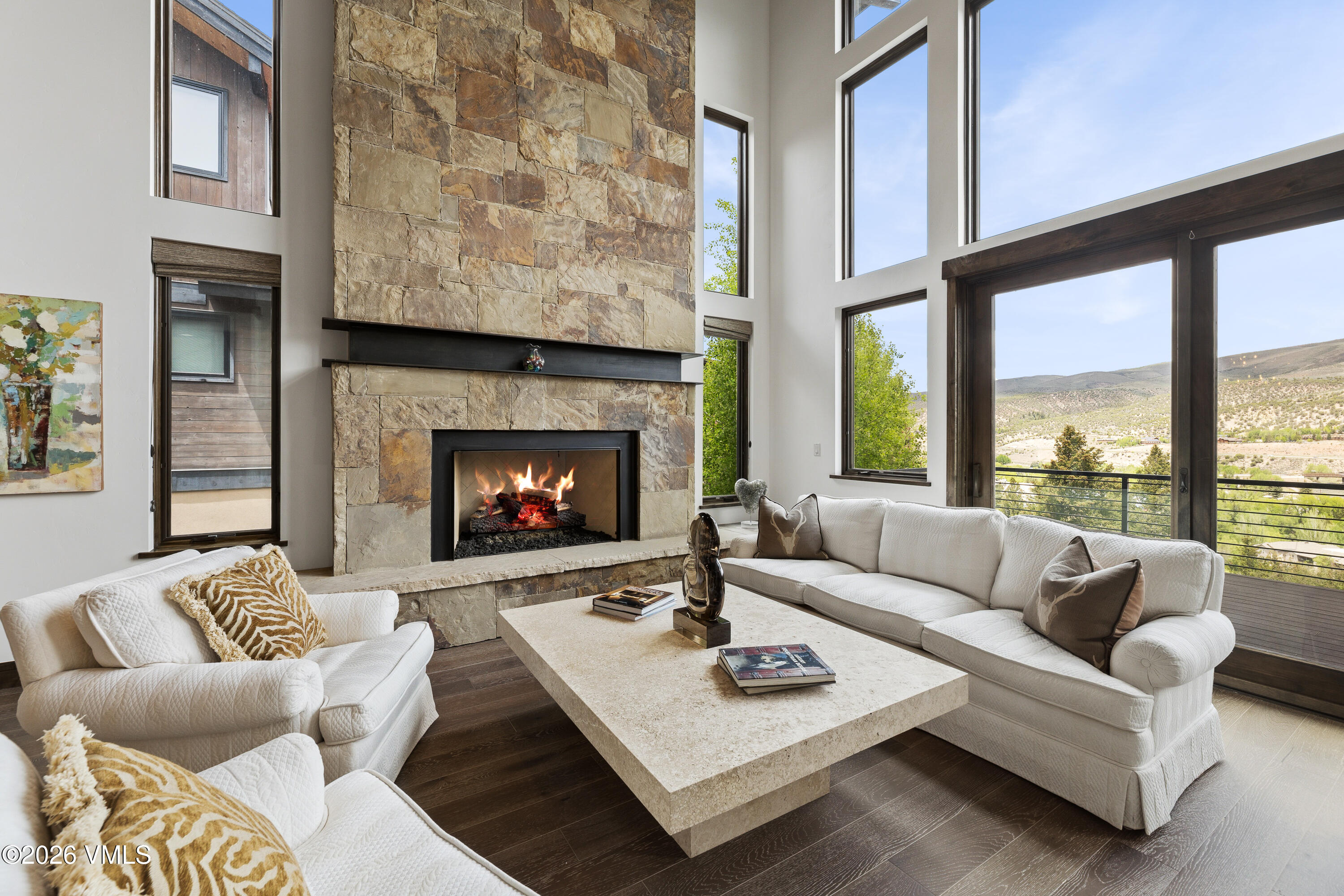91 Edwards Pointe Edwards, CO 81632 - Photo 5 of 39 a living room with furniture a fireplace and a large window