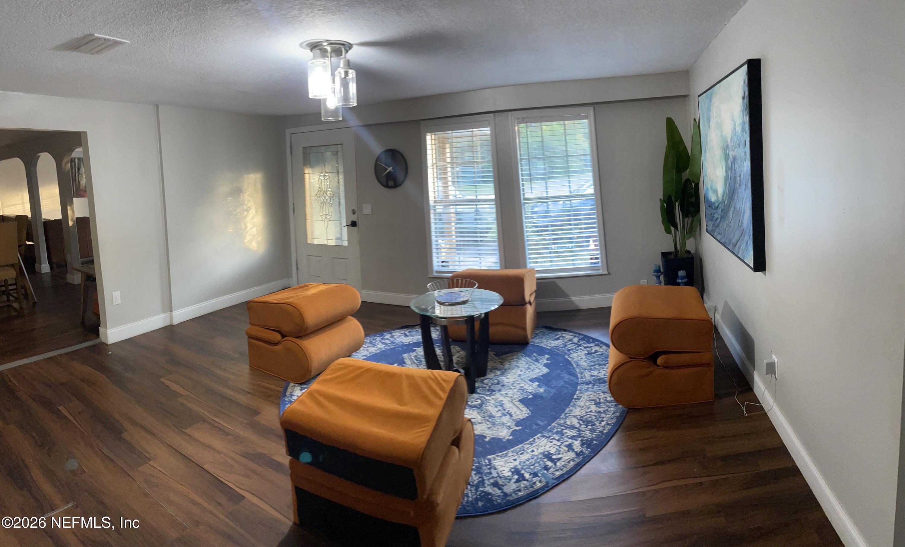 5884 Retha Road Jacksonville, FL 32254 - Photo 12 of 16 a bedroom with furniture and a window