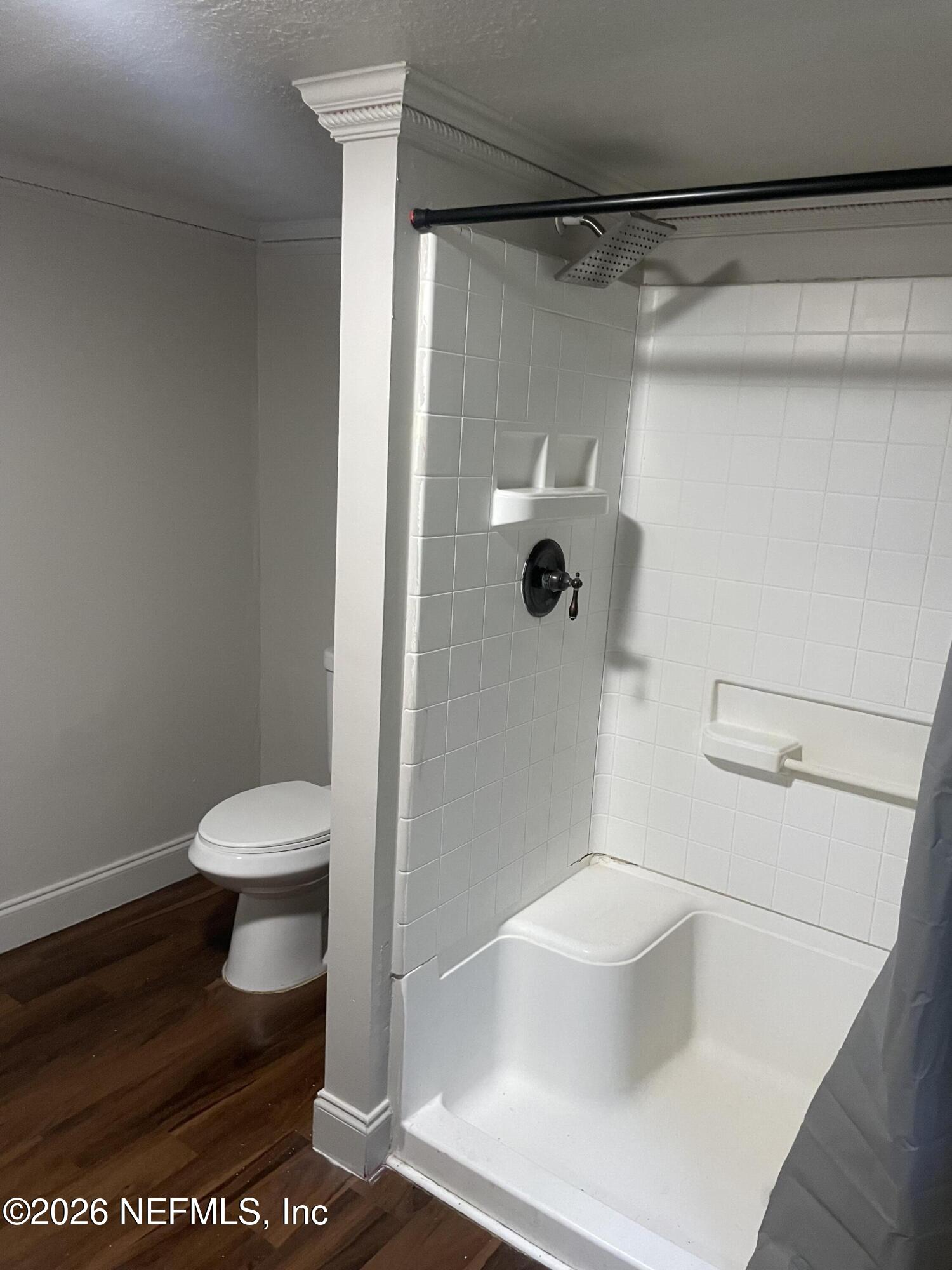 5884 Retha Road Jacksonville, FL 32254 - Photo 13 of 16 a bathroom with a toilet and a shower