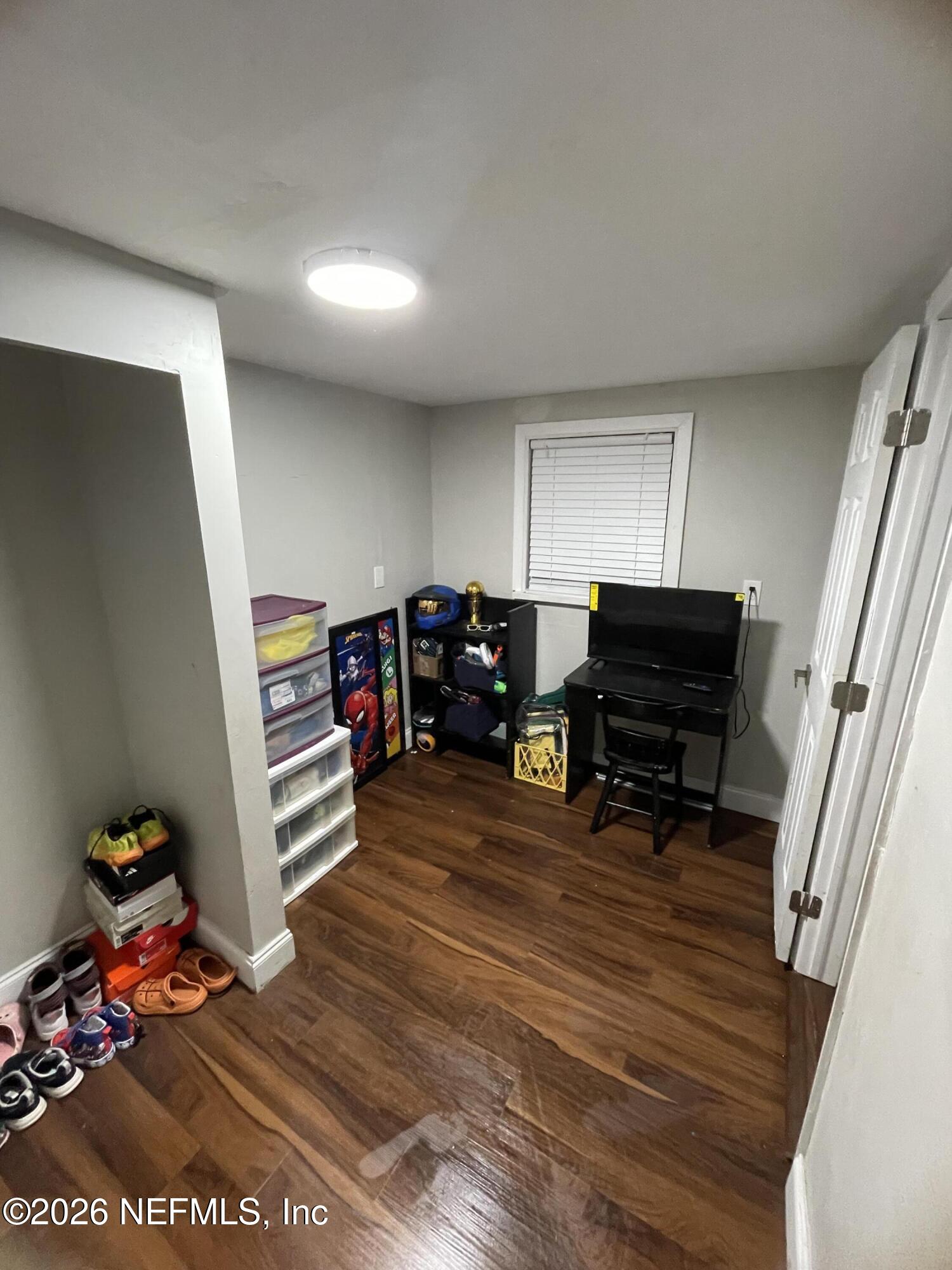5884 Retha Road Jacksonville, FL 32254 - Photo 16 of 16 a living room with furniture and a wooden floor