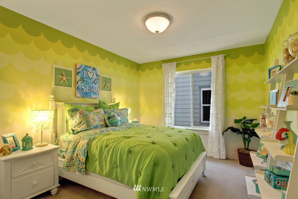 3532 178th Street Southeast, Unit 1002 Bothell, WA 98012 - Photo 14 of 25 a bedroom with a bed and a window