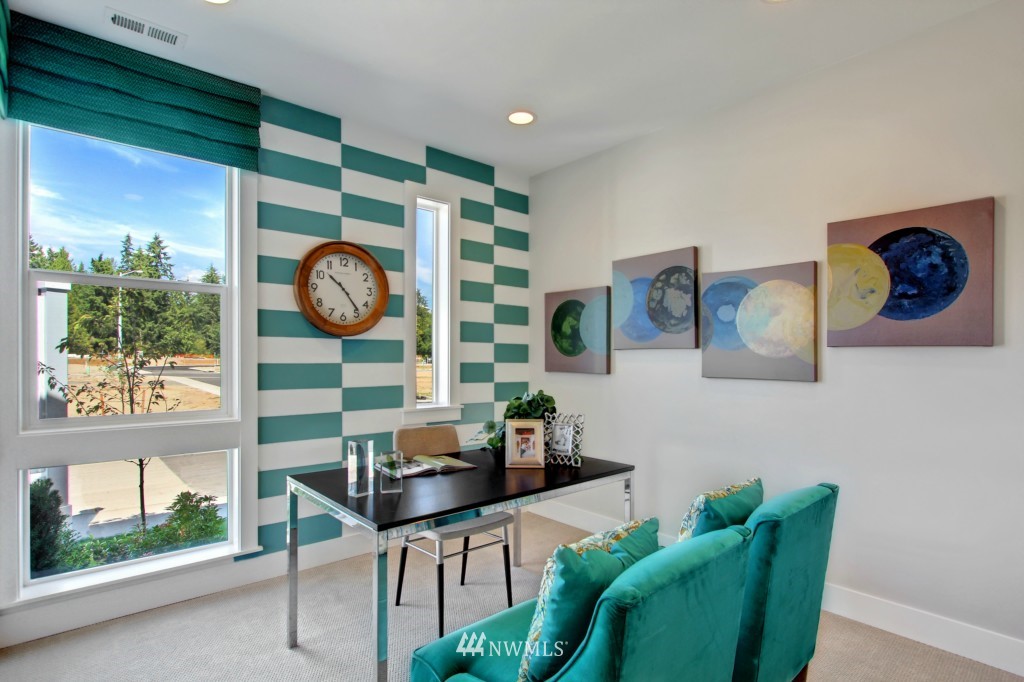 3532 178th Street Southeast, Unit 1002 Bothell, WA 98012 - Photo 3 of 25 a living room with furniture and a large window