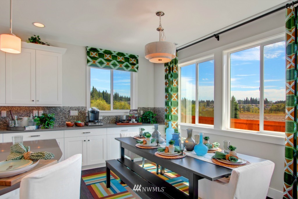 3532 178th Street Southeast, Unit 1002 Bothell, WA 98012 - Photo 5 of 25 a very nice looking dining room with a large window and kitchen table