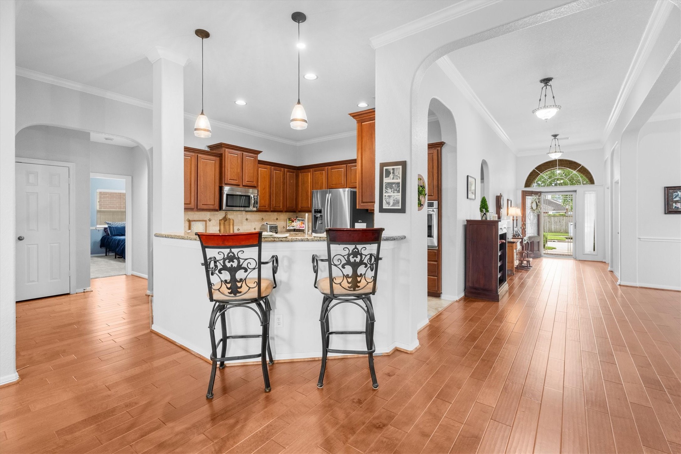 9406 Lochflora Drive Spring, TX 77379 - Photo 16 of 49 an open kitchen with a table and chairs
