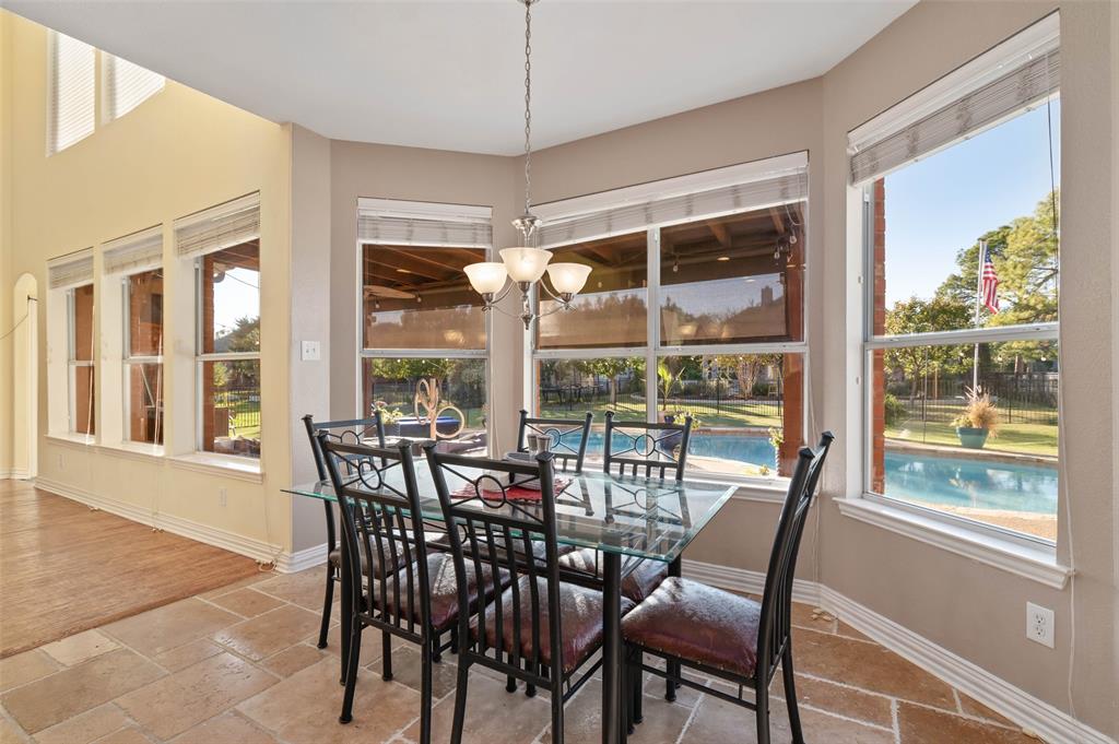 1100 Durango Circle Shady Shores, TX 76208 - Photo 12 of 39 a view of a dining room with furniture large windows and wooden floor