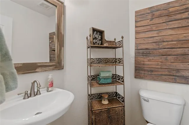 a bathroom with a toilet and a sink