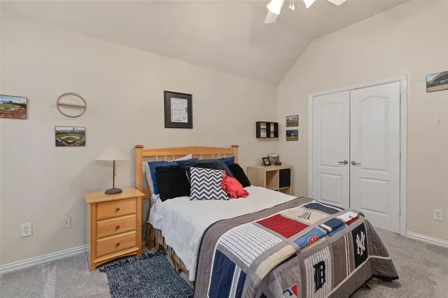 a bedroom with a bed and a cabinets