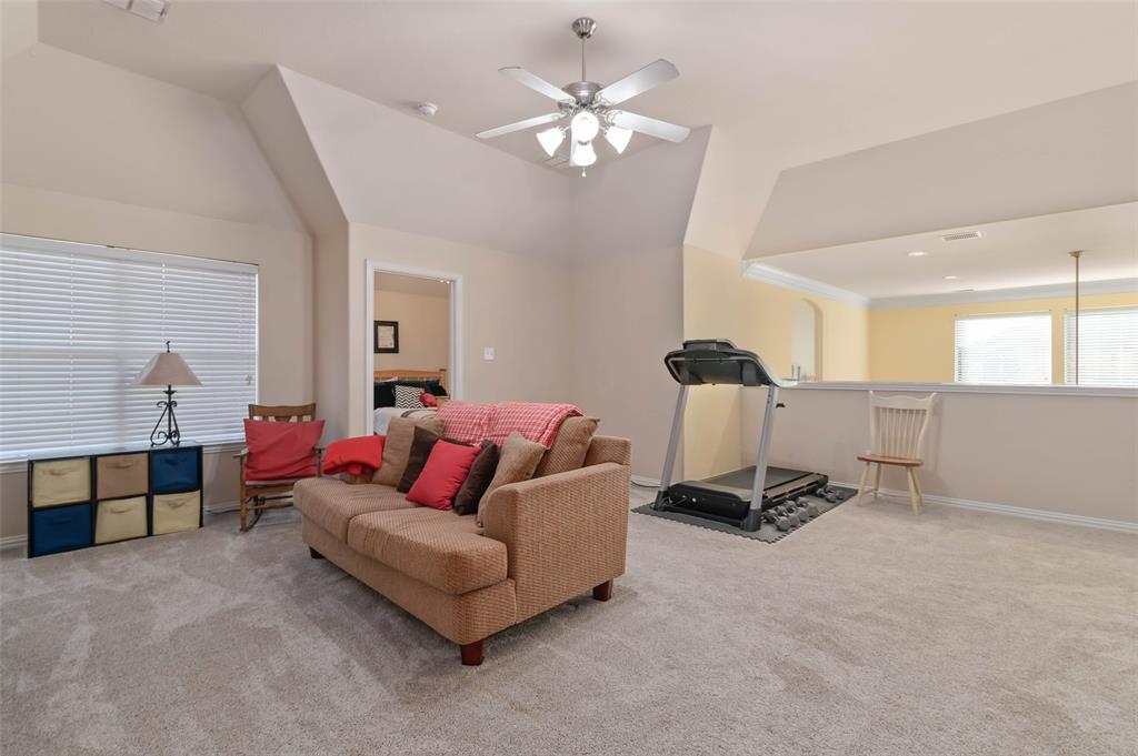 1100 Durango Circle Shady Shores, TX 76208 - Photo 24 of 39 a living room with furniture and a chandelier