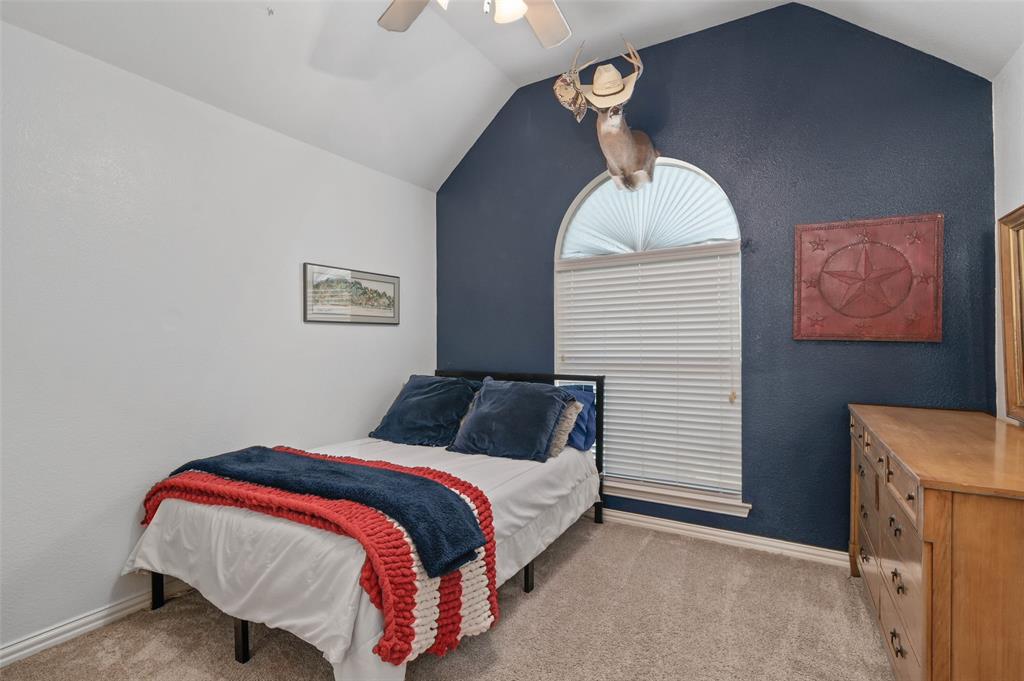1100 Durango Circle Shady Shores, TX 76208 - Photo 26 of 39 a bedroom with a bed and a painting on the wall