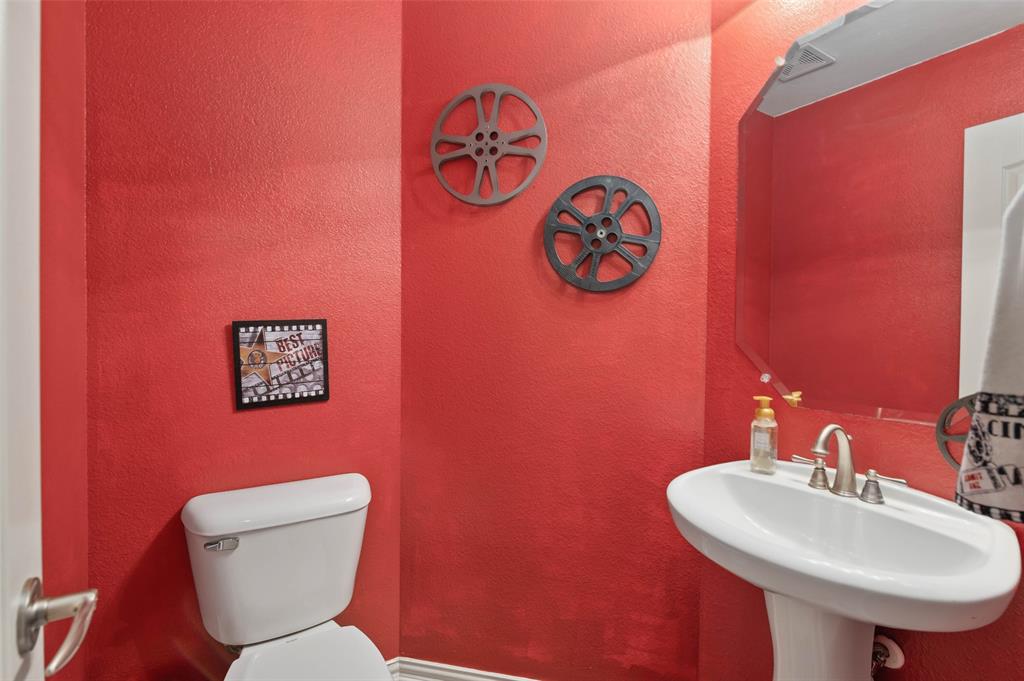 1100 Durango Circle Shady Shores, TX 76208 - Photo 32 of 39 a bathroom with a toilet sink and mirror