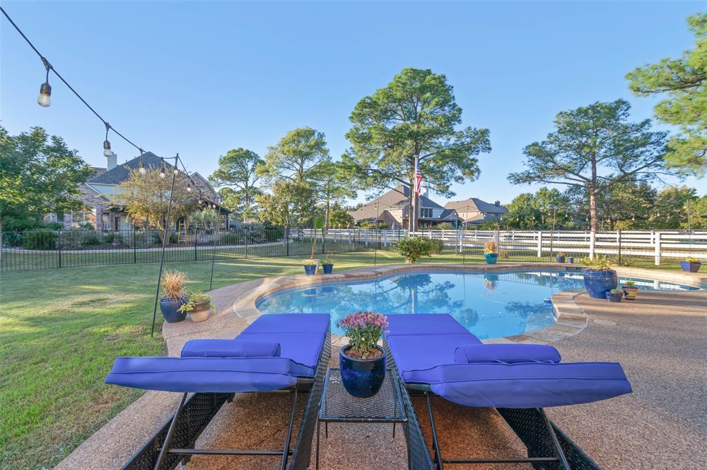 1100 Durango Circle Shady Shores, TX 76208 - Photo 33 of 39 a view of a swimming pool with a lounge chair and a lake view