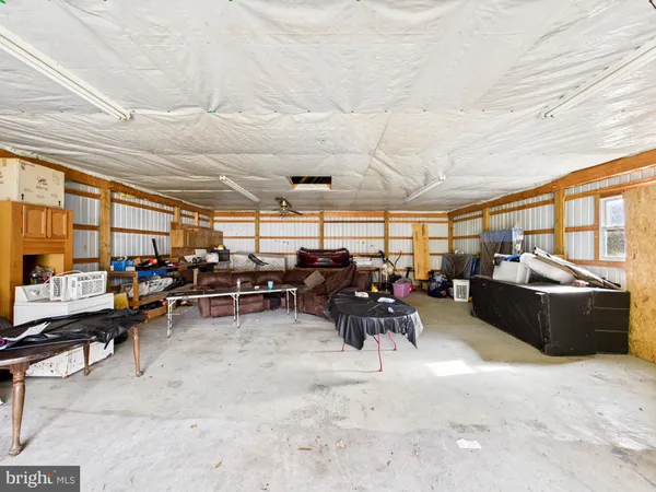 a living room with lots of furniture and a projector