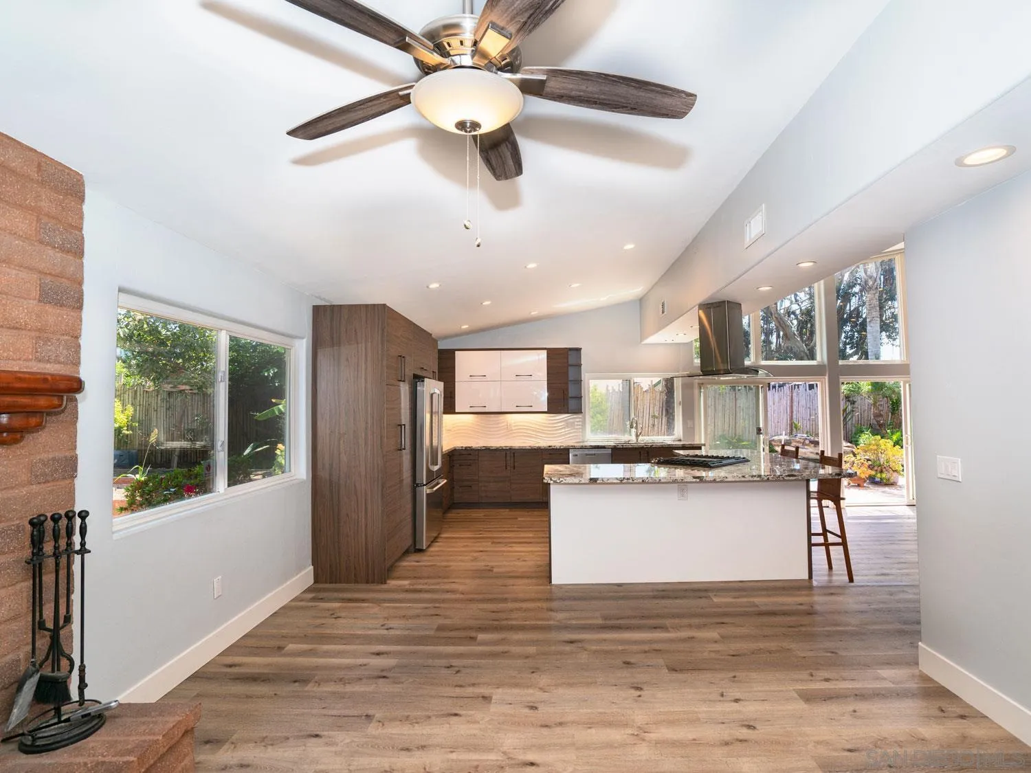 2043 Janet Circle Oceanside, CA 92054 - Photo 11 of 27 a kitchen with stainless steel appliances kitchen island granite countertop a stove and a refrigerator