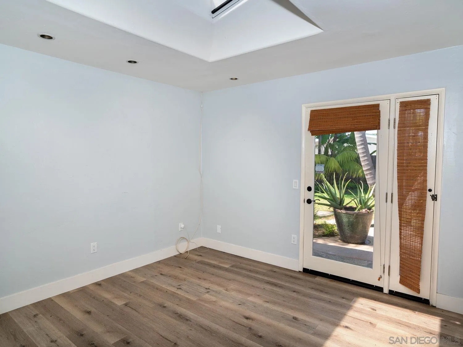 2043 Janet Circle Oceanside, CA 92054 - Photo 13 of 27 a view of an empty room with wooden floor and a window
