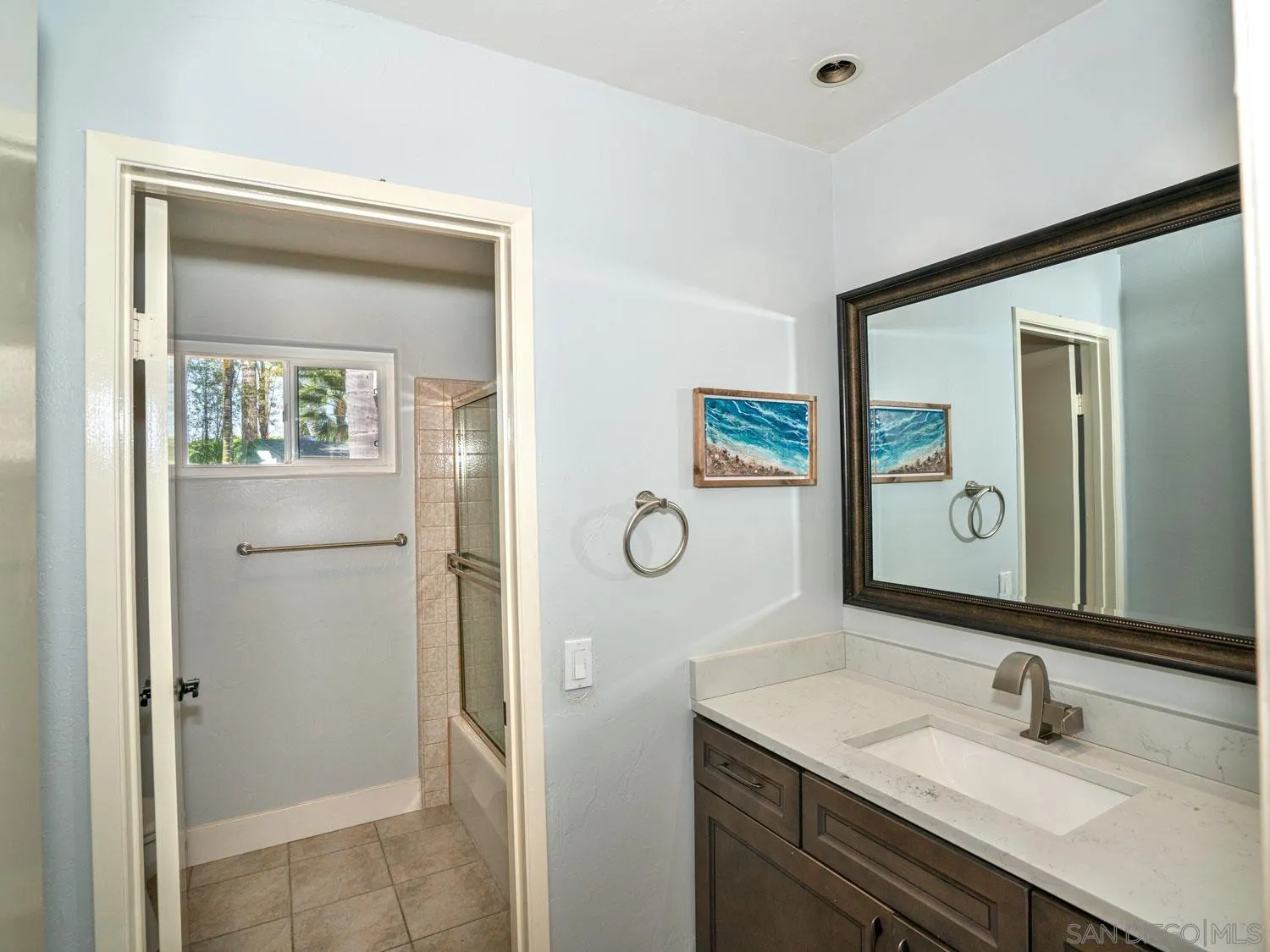 2043 Janet Circle Oceanside, CA 92054 - Photo 16 of 27 a bathroom with a sink and a mirror