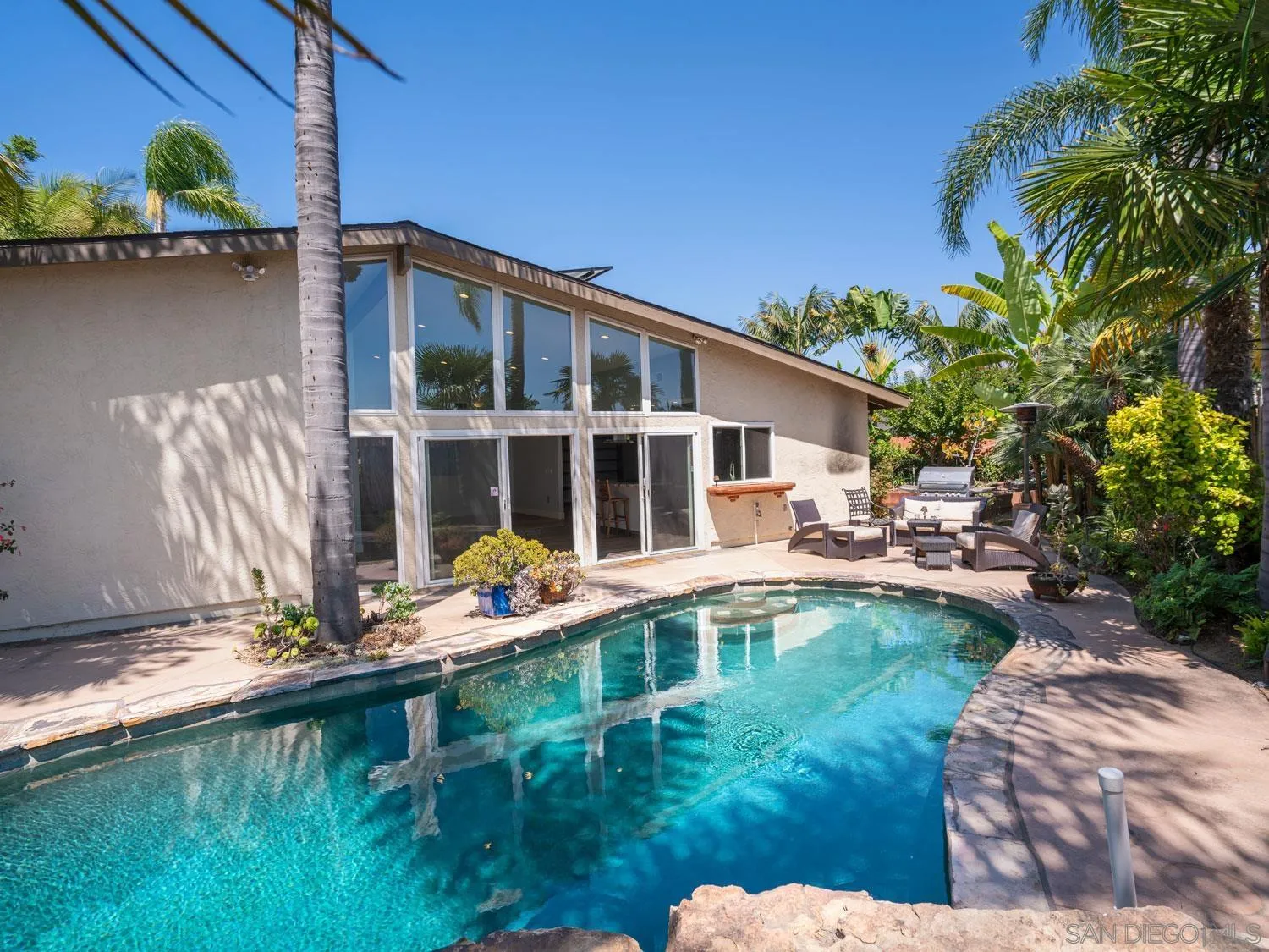 2043 Janet Circle Oceanside, CA 92054 - Photo 17 of 27 a house with swimming pool in front of it