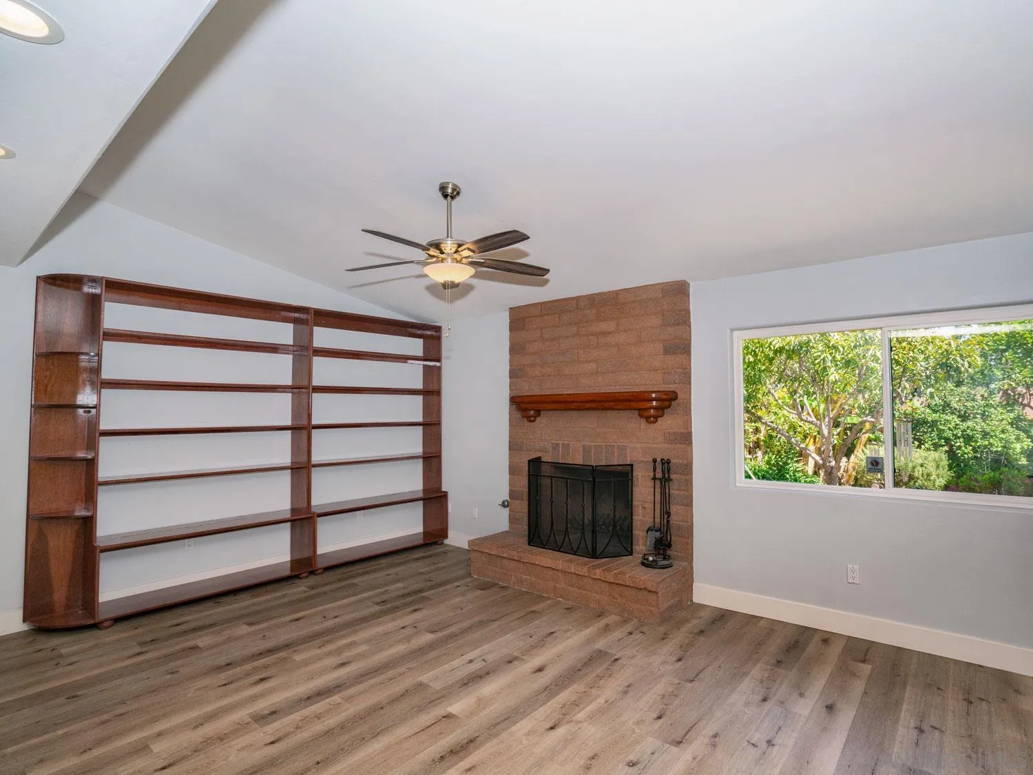 2043 Janet Circle Oceanside, CA 92054 - Photo 10 of 27 a view of empty room with wooden floor and fan