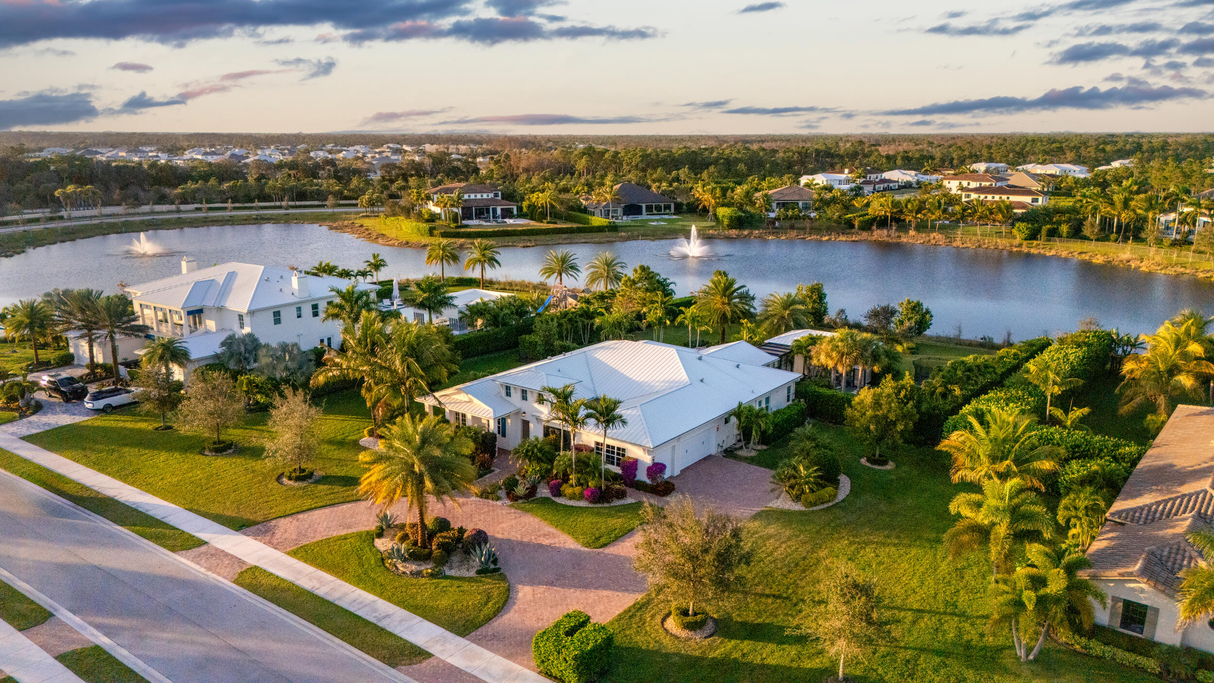 8001 Southeast Plantation Circle Jupiter, FL 33458 - Photo 1 of 50 an aerial view of a house with a lake view