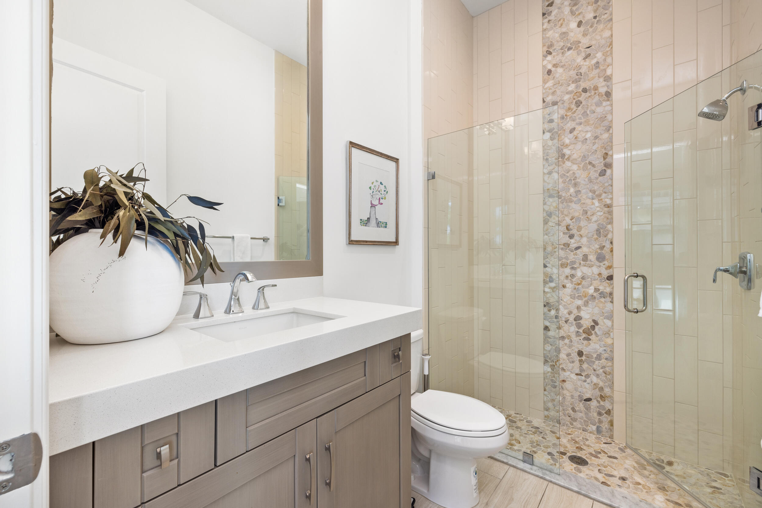 8001 Southeast Plantation Circle Jupiter, FL 33458 - Photo 27 of 50 a bathroom with a granite countertop sink toilet and shower