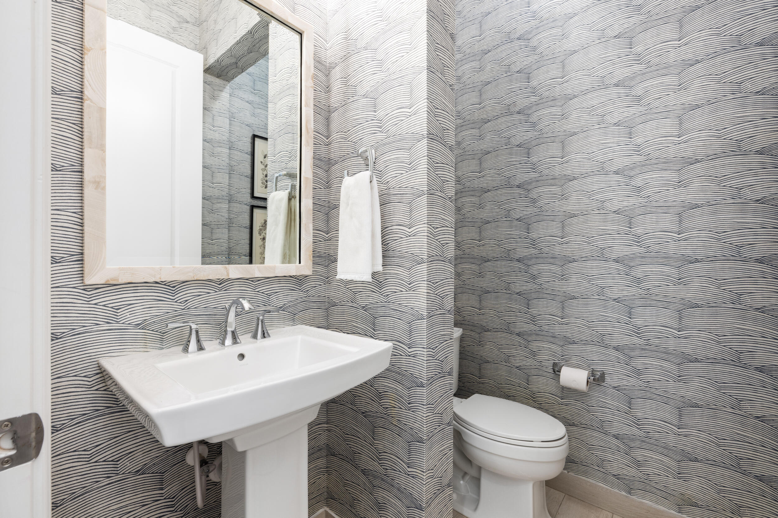 8001 Southeast Plantation Circle Jupiter, FL 33458 - Photo 28 of 50 a bathroom with a sink a toilet and a mirror