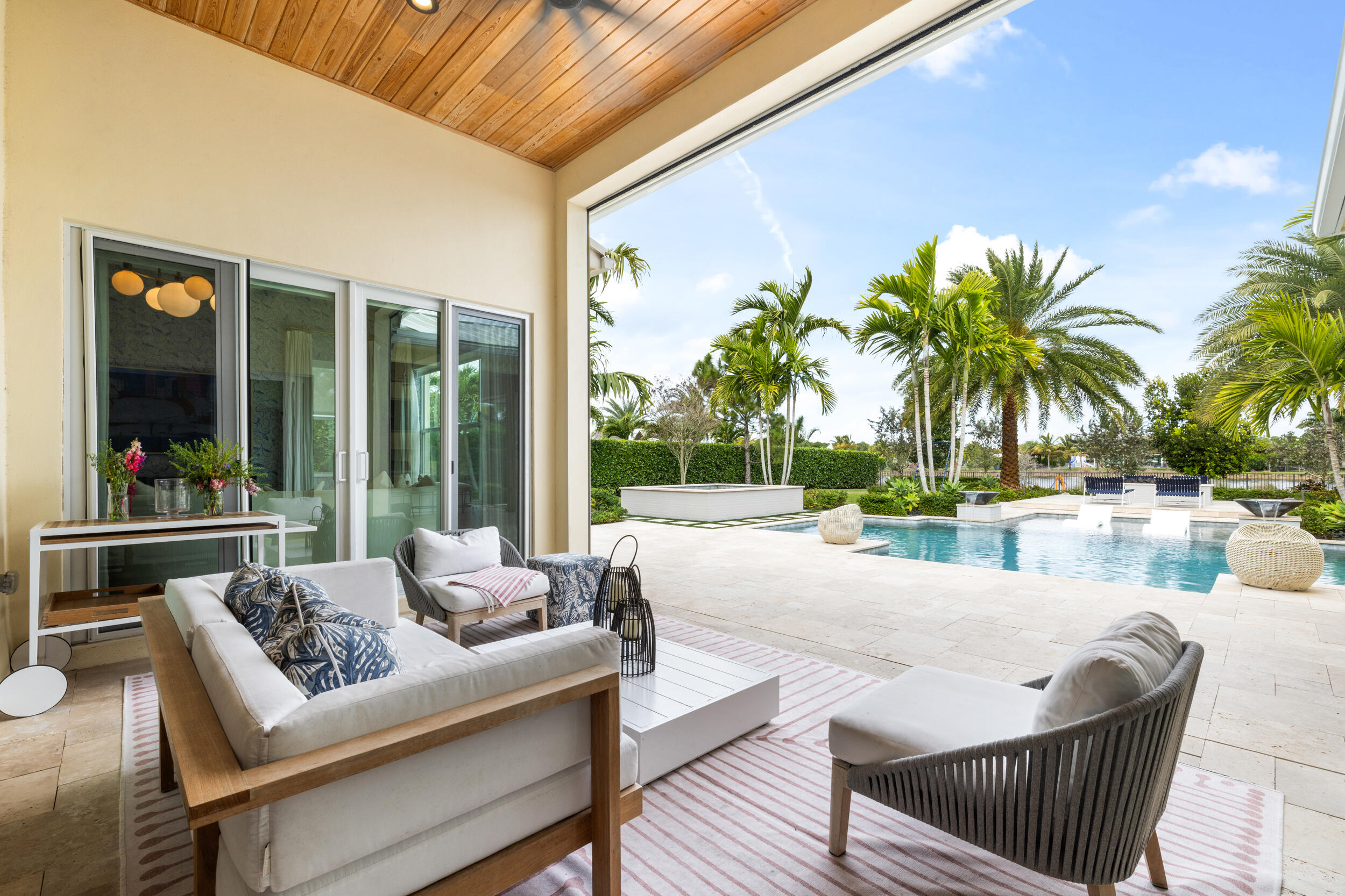 8001 Southeast Plantation Circle Jupiter, FL 33458 - Photo 33 of 50 a view of a house with swimming pool and sitting area