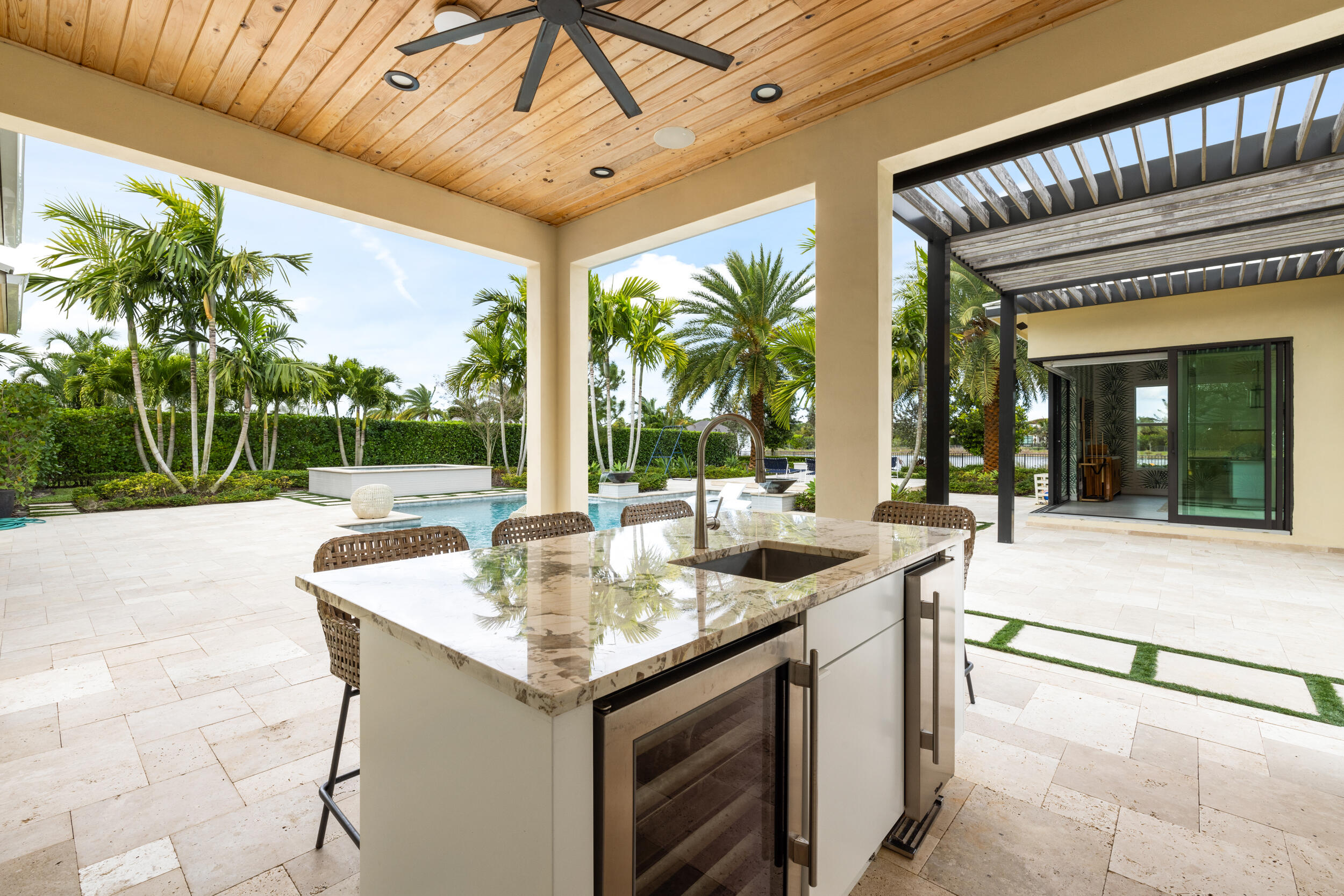 8001 Southeast Plantation Circle Jupiter, FL 33458 - Photo 35 of 50 a dinning table under an umbrella