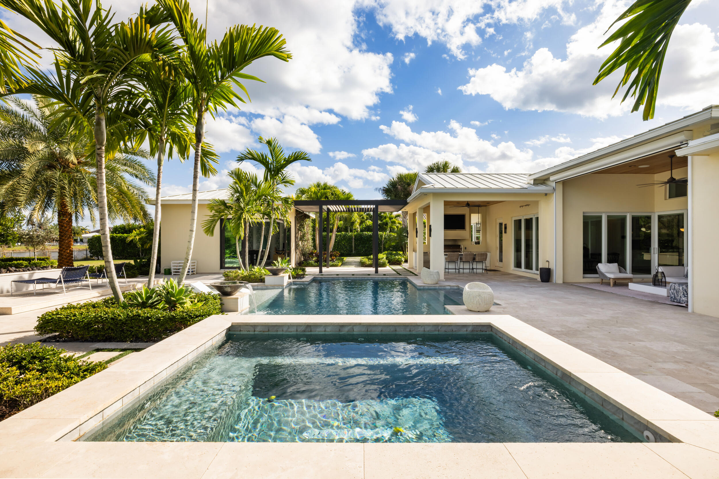 8001 Southeast Plantation Circle Jupiter, FL 33458 - Photo 36 of 50 a view of a house with swimming pool and sitting area