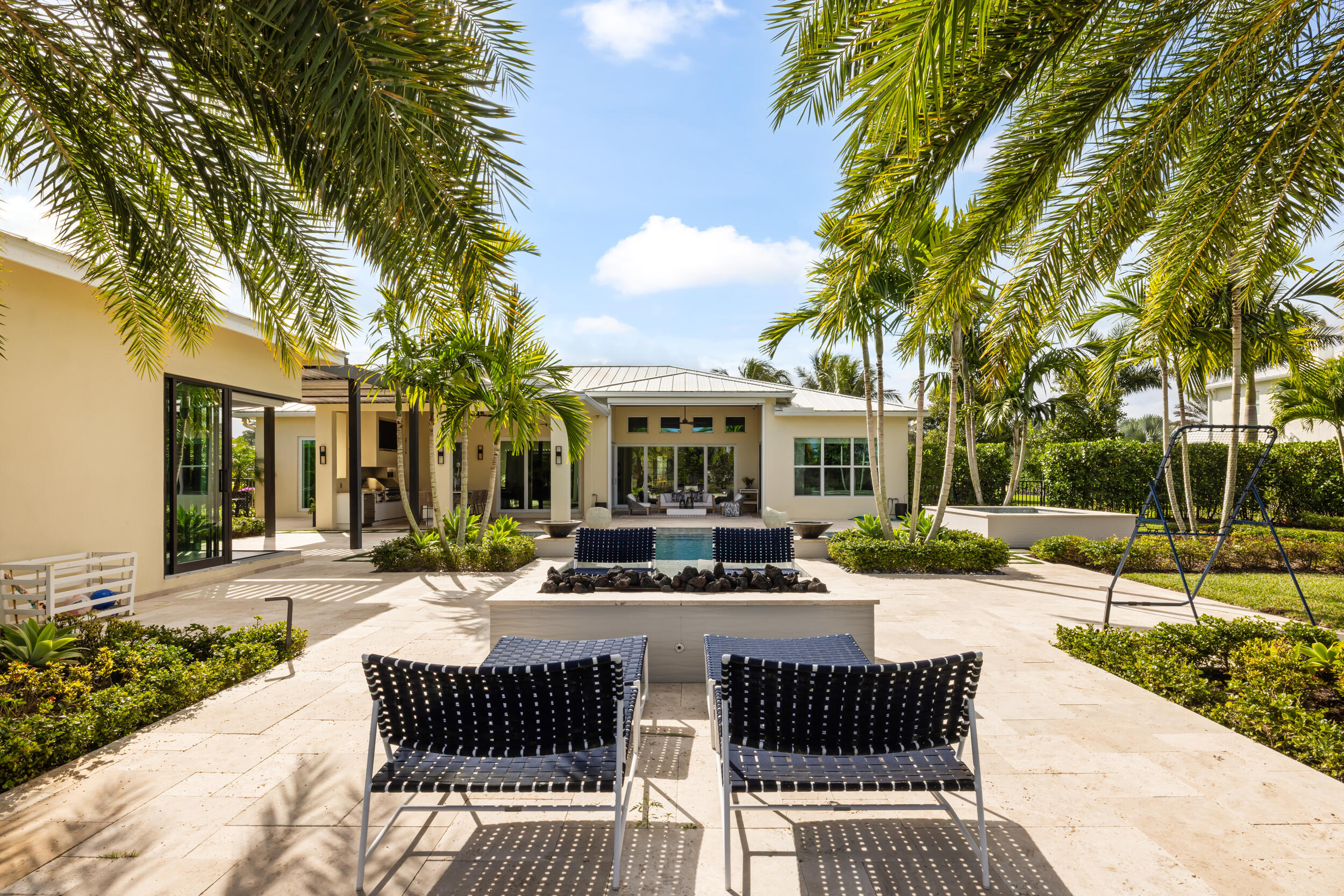 8001 Southeast Plantation Circle Jupiter, FL 33458 - Photo 38 of 50 a view of a house with backyard porch and sitting area