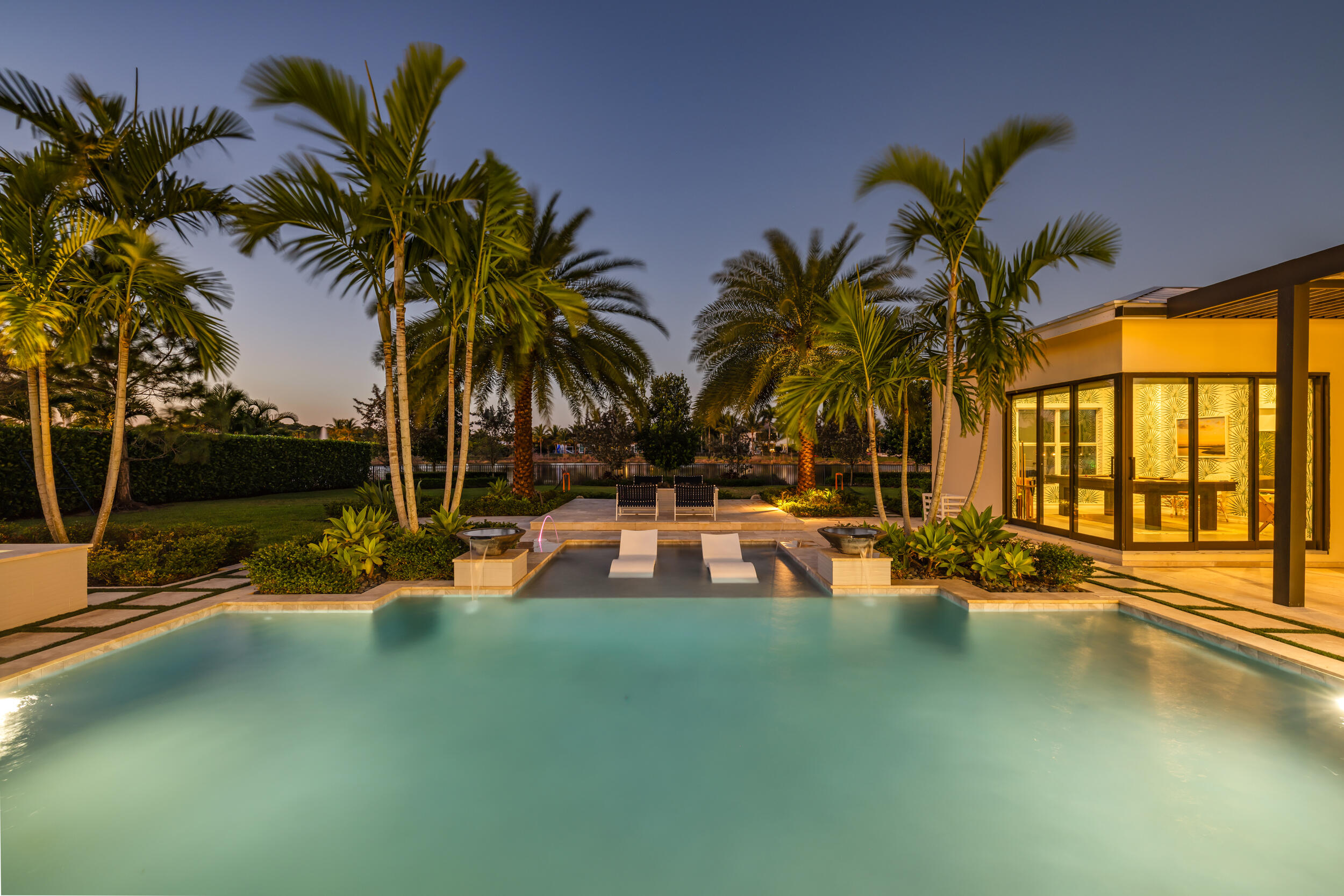 8001 Southeast Plantation Circle Jupiter, FL 33458 - Photo 45 of 50 a view of a swimming pool with a table and chairs